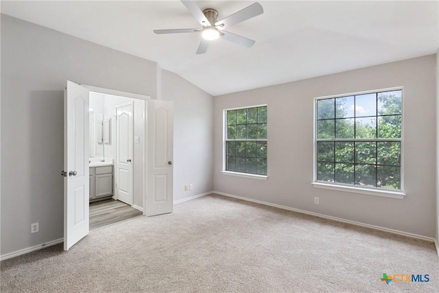 9538 Beau Brg, San Antonio, TX 78254 - unfurnished bedroom featuring carpet floors, vaulted ceiling, connected bathroom, and ceiling fan
