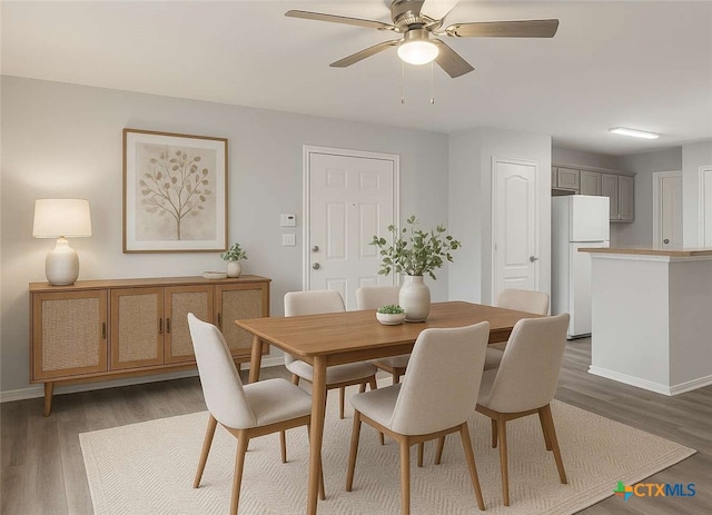 9538 Beau Brg, San Antonio, TX 78254 - dining area featuring ceiling fan and wood finished floors