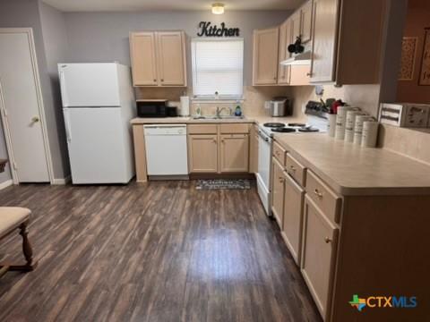 117 Clydesdale Ln, Victoria, TX 77904 - kitchen with white appliances, dark wood-type flooring, light countertops, a sink, and range hood