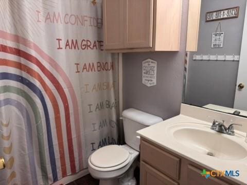 117 Clydesdale Ln, Victoria, TX 77904 - bathroom with toilet, vanity, and a shower with shower curtain