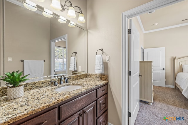 bathroom featuring vanity and ornamental molding