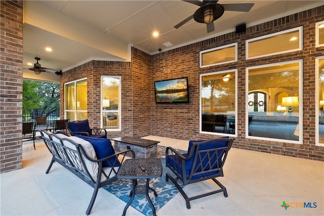 view of patio / terrace with ceiling fan and outdoor lounge area