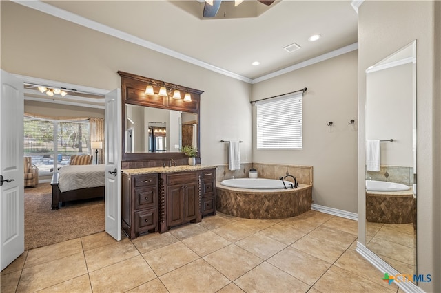 bathroom featuring vanity, ornamental molding, tile patterned floors, and tiled tub