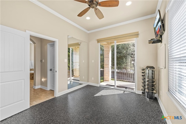 interior space featuring light tile patterned floors, ceiling fan, and crown molding