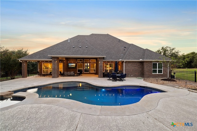 view of swimming pool featuring a patio area