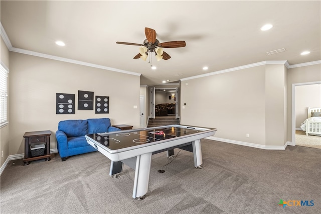 rec room featuring carpet floors, ceiling fan, and crown molding