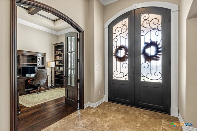 entryway featuring french doors, crown molding, and wood-type flooring