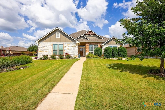 5821 Worthing Dr, Temple, TX 76502 - craftsman house featuring a front lawn, board and batten siding, and stone siding