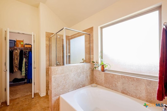5821 Worthing Dr, Temple, TX 76502 - bathroom with a stall shower, a garden tub, a walk in closet, and tile patterned floors