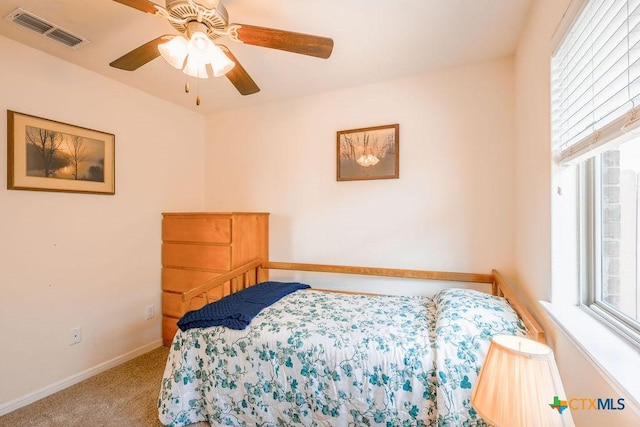 5821 Worthing Dr, Temple, TX 76502 - carpeted bedroom with multiple windows and a ceiling fan
