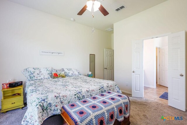 5821 Worthing Dr, Temple, TX 76502 - carpeted bedroom with tile patterned flooring and a ceiling fan