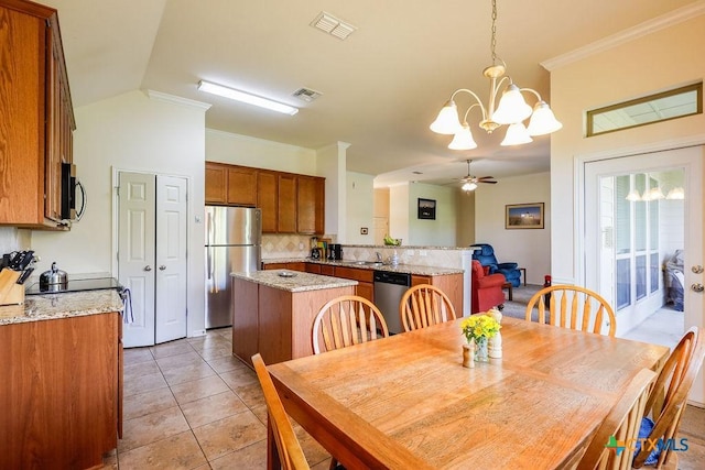 5821 Worthing Dr, Temple, TX 76502 - dining space with a chandelier, light tile patterned flooring, a ceiling fan, and crown molding