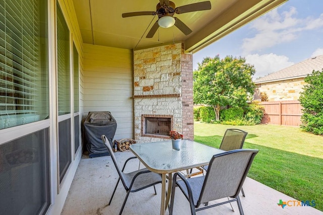 5821 Worthing Dr, Temple, TX 76502 - view of patio with an outdoor stone fireplace, outdoor dining space, area for grilling, and a ceiling fan