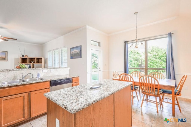 5821 Worthing Dr, Temple, TX 76502 - kitchen with dishwasher, ornamental molding, decorative backsplash, a kitchen island, and light tile patterned flooring