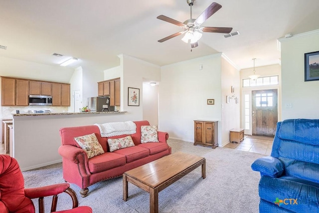 5821 Worthing Dr, Temple, TX 76502 - living area featuring ceiling fan, ornamental molding, light colored carpet, a towering ceiling, and light tile patterned floors