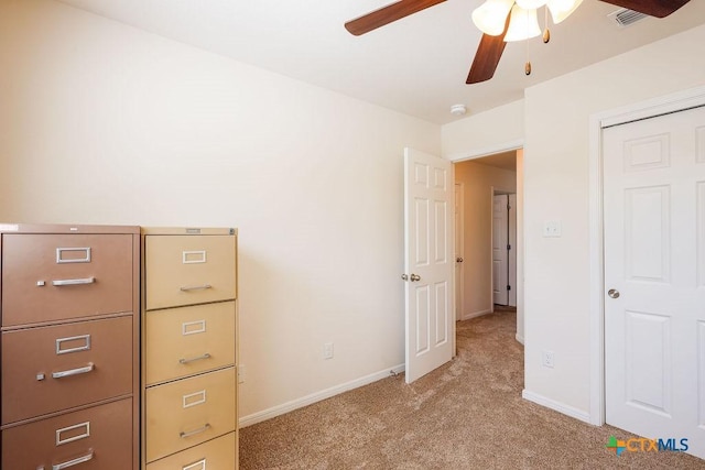 5821 Worthing Dr, Temple, TX 76502 - unfurnished bedroom with light carpet and a ceiling fan