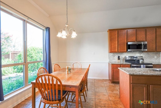 5821 Worthing Dr, Temple, TX 76502 - dining room with a chandelier and lofted ceiling