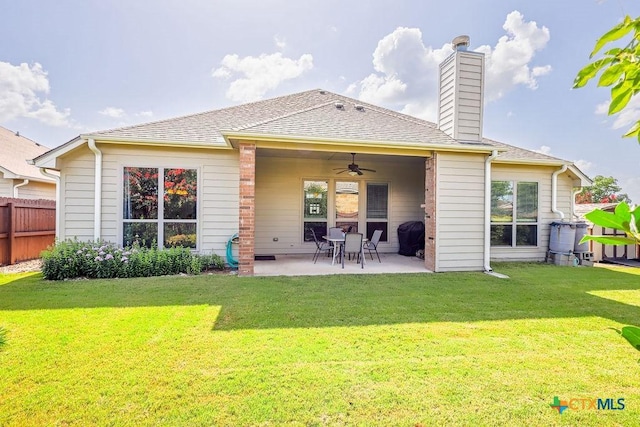 5821 Worthing Dr, Temple, TX 76502 - rear view of property featuring a ceiling fan, a patio, and a chimney