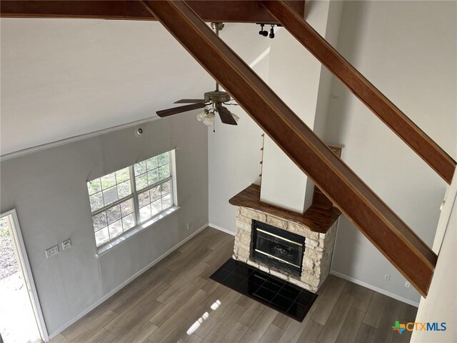 114 N Andrews Dr, Robinson, TX 76706 - interior details featuring a fireplace, wood finished floors, baseboards, and ceiling fan