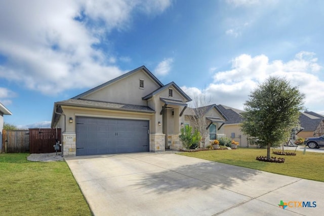 view of front of home featuring a garage and a front lawn