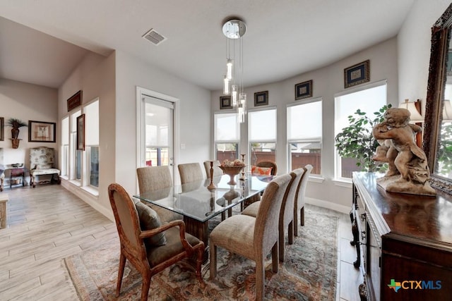 dining space featuring light wood-type flooring