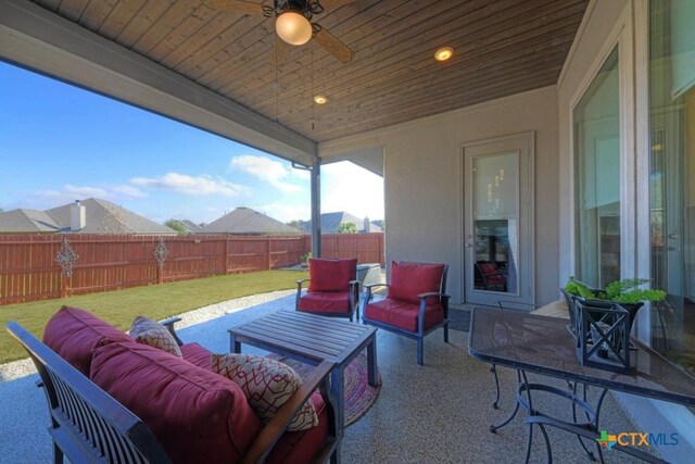 view of patio / terrace with an outdoor living space and ceiling fan