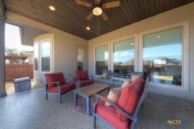 view of patio with an outdoor living space and ceiling fan