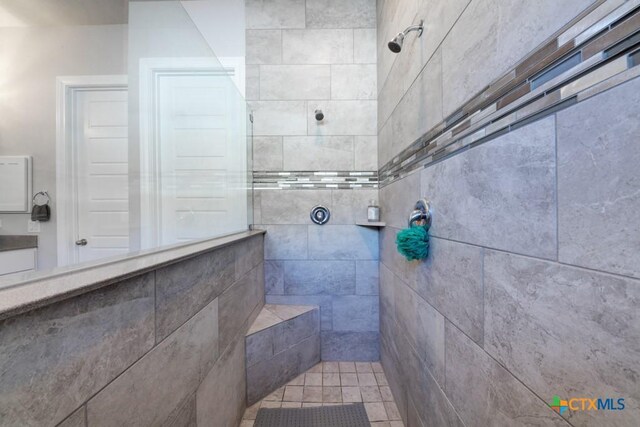 bathroom with tiled shower