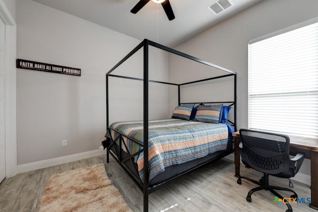 bedroom featuring light hardwood / wood-style flooring and ceiling fan