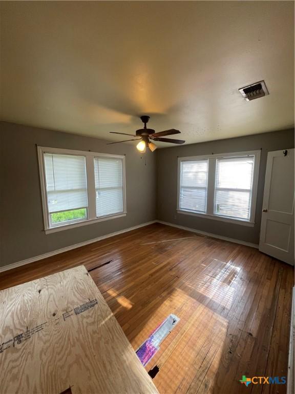 1505 E Park Ave, Victoria, TX 77901 - unfurnished bedroom with wood-type flooring and ceiling fan