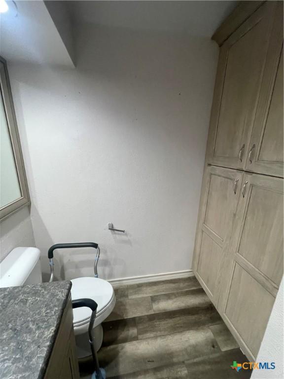 1505 E Park Ave, Victoria, TX 77901 - half bathroom with wood finished floors and vanity