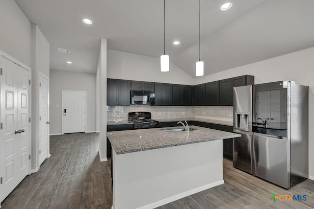 kitchen with sink, hanging light fixtures, light stone countertops, decorative backsplash, and black appliances