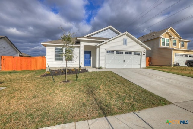 view of front of home with a garage and a front yard