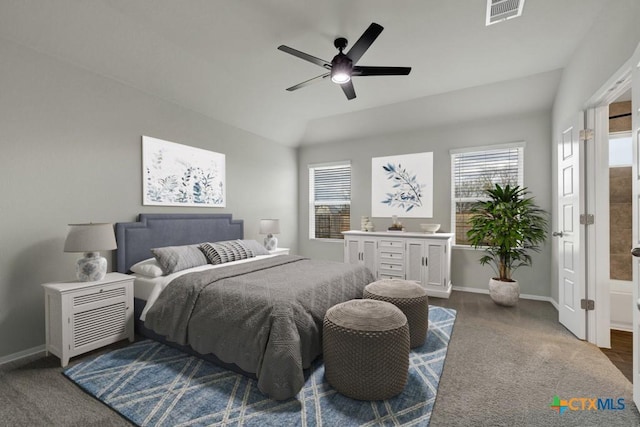 bedroom with ceiling fan and dark colored carpet