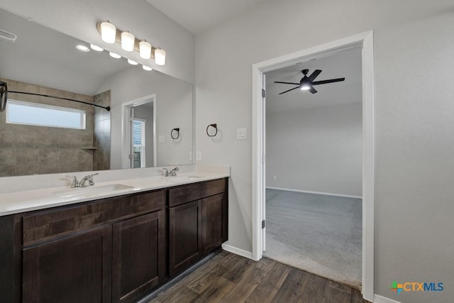 bathroom with hardwood / wood-style flooring, vanity, and ceiling fan