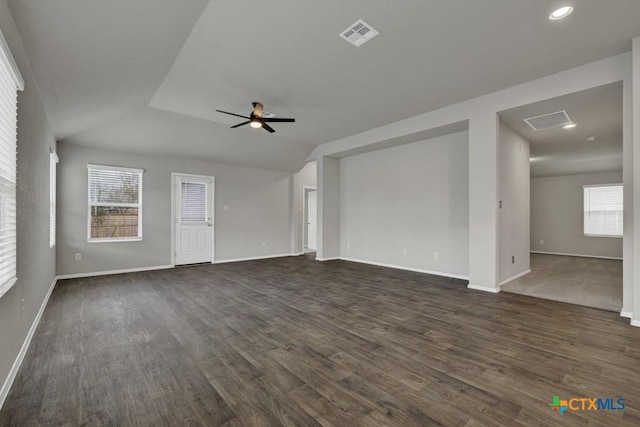 unfurnished living room featuring dark wood-type flooring, ceiling fan, and vaulted ceiling