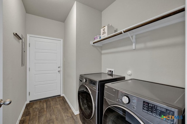 laundry room with dark hardwood / wood-style floors and independent washer and dryer