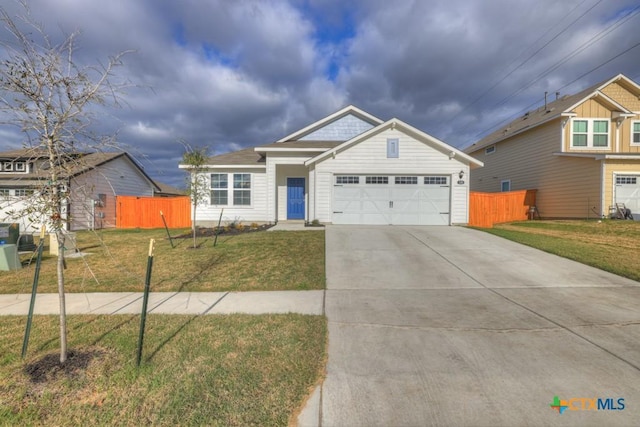 view of front of house featuring a garage and a front yard