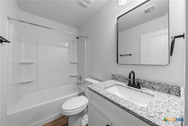 bathroom with toilet, wood finished floors, vanity, and visible vents