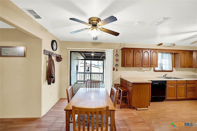 dining area with ceiling fan, baseboards, visible vents, and light wood-style floors