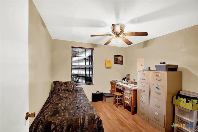 bedroom with light wood-style flooring and ceiling fan