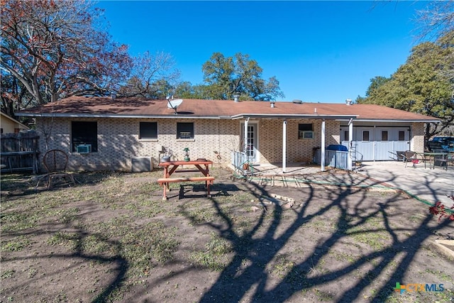 rear view of house featuring a patio