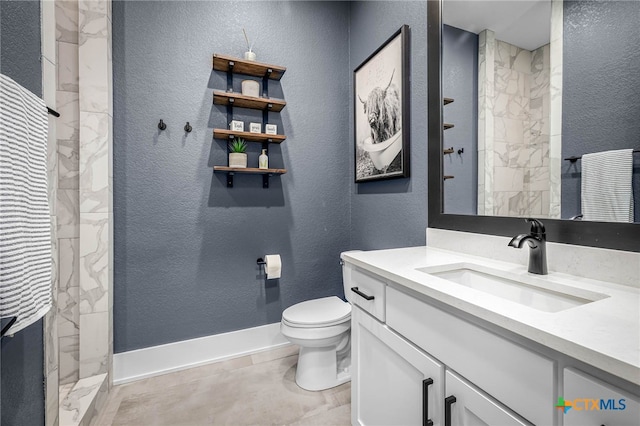 bathroom with vanity, toilet, and walk in shower