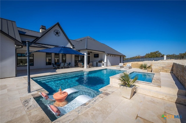 view of swimming pool with a patio