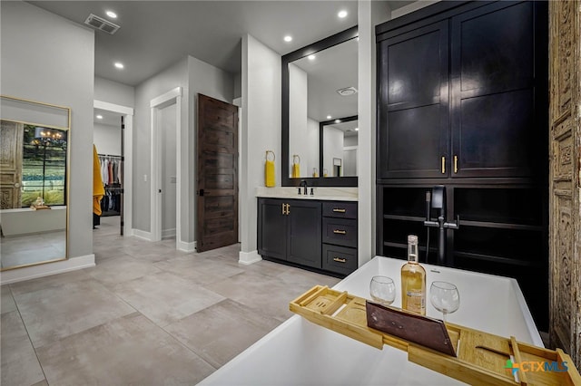 bathroom featuring vanity and a bathtub