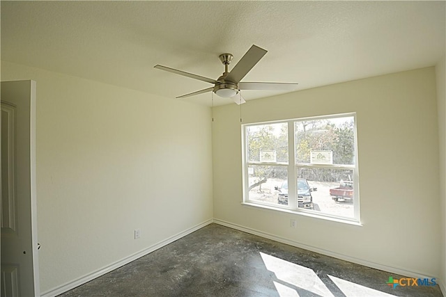 unfurnished room with a textured ceiling and ceiling fan