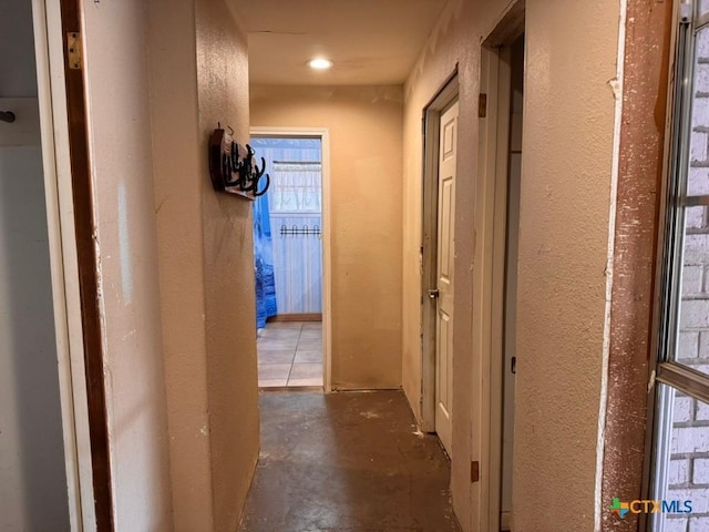 2708 E Poplar Ave, Victoria, TX 77901 - hall featuring a textured wall and unfinished concrete floors