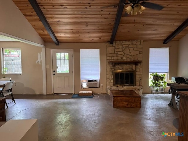 2708 E Poplar Ave, Victoria, TX 77901 - living room featuring wood ceiling, finished concrete flooring, ceiling fan, a stone fireplace, and cooling unit