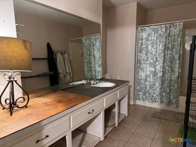 2708 E Poplar Ave, Victoria, TX 77901 - bathroom featuring tile patterned flooring, vanity, and shower / bath combo
