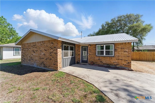 226 Gruene Rd, New Braunfels, TX 78130 - view of front of property featuring brick siding, fence, and a patio area